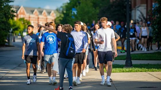 Student K Crew leader giving a tour to a group of new students